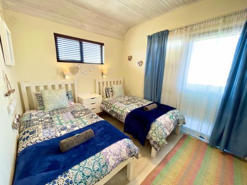 Llit o llits en una habitació de Central Beachhouse
