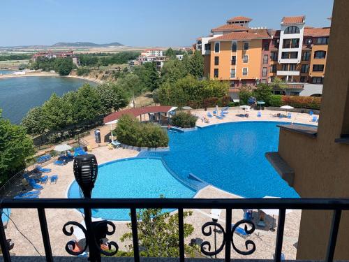 a view of a swimming pool from a balcony at Seaview Young Family - Семейство на Черно море in Aheloy