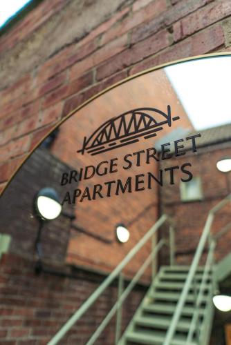 a sign on the side of a brick building at Judges suite apartment with spa facilities in Morpeth