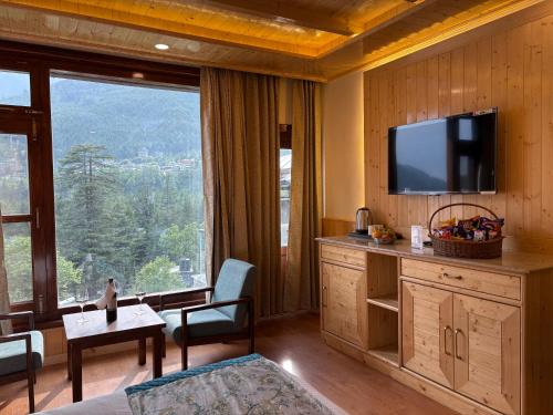 TV i/ili multimedijalni sistem u objektu Snow Park Villas & Resort