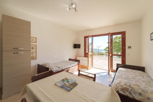 Postel nebo postele na pokoji v ubytování Appartamenti Le Miniere 2 e 3 - Goelba