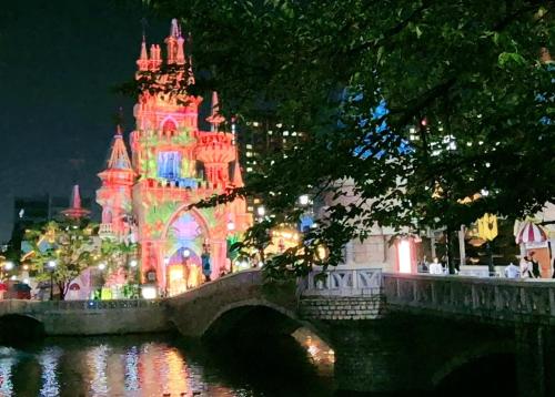a castle lit up with christmas lights next to a river at OpenㆍJamsil Lake Stay in Seoul