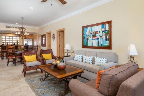 a living room with a couch and a table at Unwind in Style Villa La Estancia Cabo in Cabo San Lucas