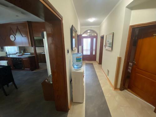 a room with a refrigerator with a bottle of water on it at Vila Madams - Palić-Serbia in Palić