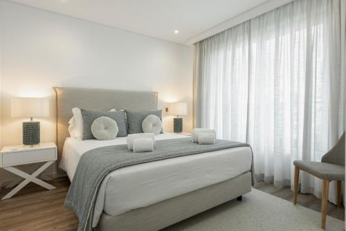 Postel nebo postele na pokoji v ubytování Terracos de Quarteira II Caribe by Real Properties