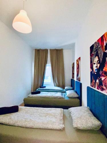 Katil atau katil-katil dalam bilik di Cozy 4-Bedroom shared Apartment ,Perfect for Groups
