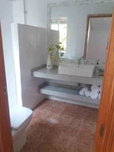 a bathroom with a sink and a mirror at Casa Aqua in Mazarrón