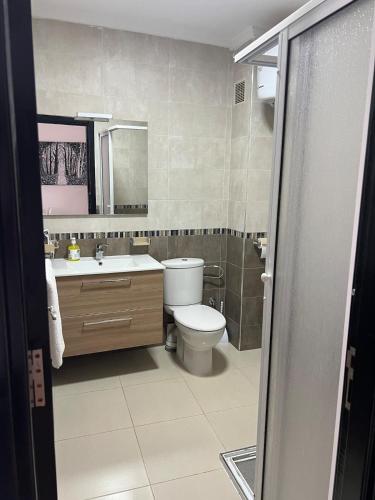 a bathroom with a toilet and a sink at Equipped studio in Tetouan in Tétouan