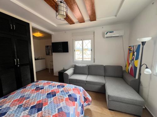a living room with a couch and a bed at Equipped studio in Tetouan in Tétouan