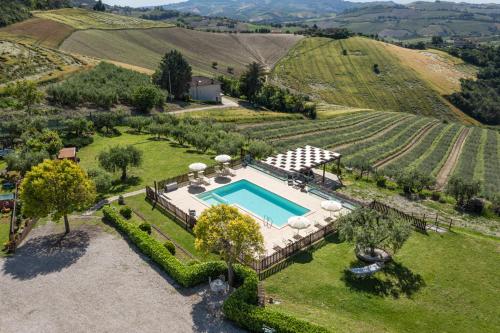 an aerial view of an estate with a swimming pool at La Rosa & La Viola in Carassai