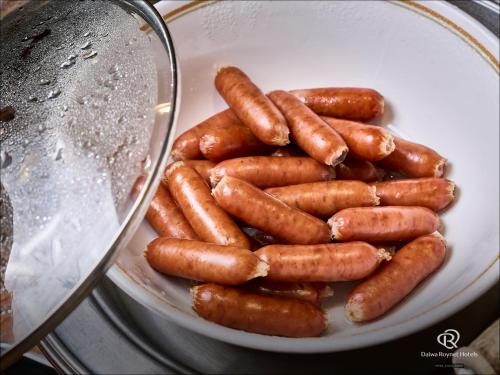 a bowl of carrots sitting on a table at Daiwa Roynet Hotel Numazu in Numazu