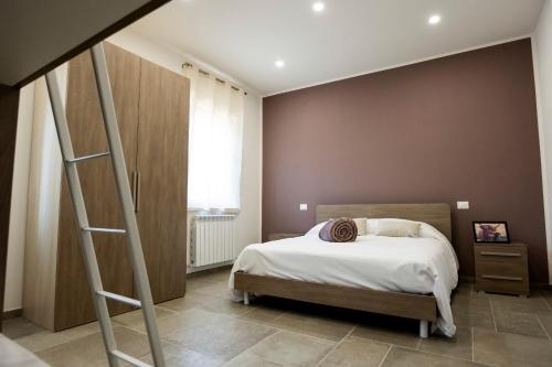 a bedroom with a bed and a ladder at Da MammaMimma in Cascia