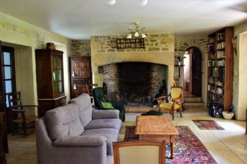 Posezení v ubytování Ma maison de famille en Quercy avec piscine