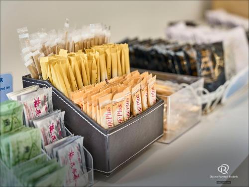 a display of cheesesticks and other packaged food at Daiwa Roynet Hotel Numazu in Numazu