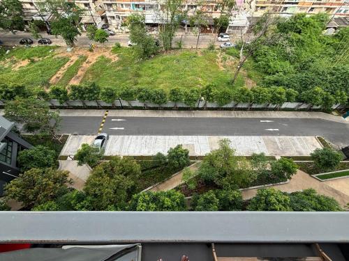 an overhead view of an empty parking lot with trees at Nich Mono Ramkhumheng Low Rise in Sathani Ban Hua Mak