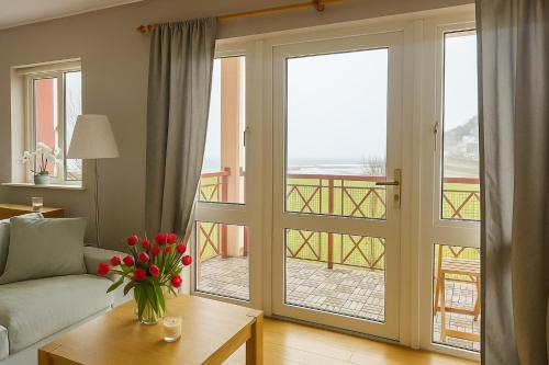 a living room with a sliding glass door with a view at Youghal in Youghal
