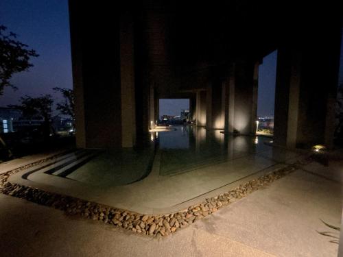 a building with a walkway at night at Nich Mono Ramkhumheng Low Rise in Sathani Ban Hua Mak