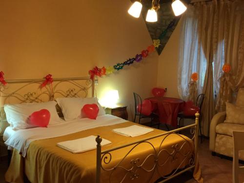a bedroom with a bed with red hearts on it at B&B Panta Rei in Cicerale