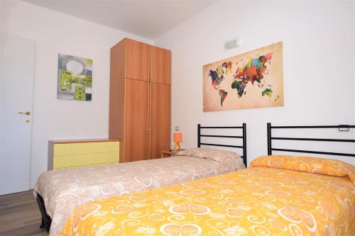 Ένα ή περισσότερα κρεβάτια σε δωμάτιο στο Appartamento Trilocale Acquazzurra