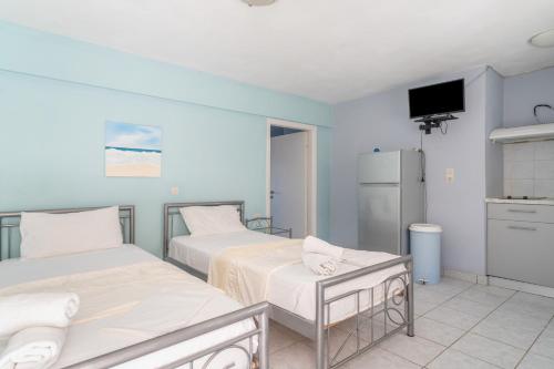Ένα ή περισσότερα κρεβάτια σε δωμάτιο στο Giorgio studios-apartments 1