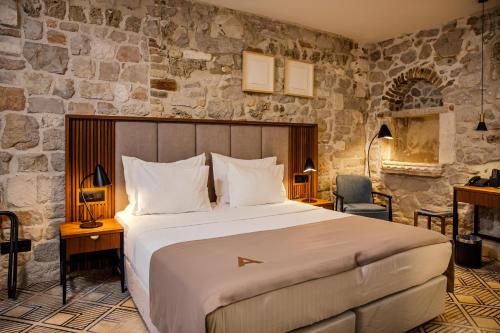 Postel nebo postele na pokoji v ubytování Armerun Heritage Hotel & Residences