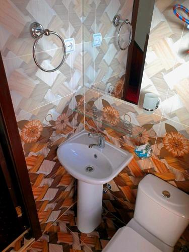a bathroom with a sink and a toilet at Sky Village, Chimgan in Chimgan
