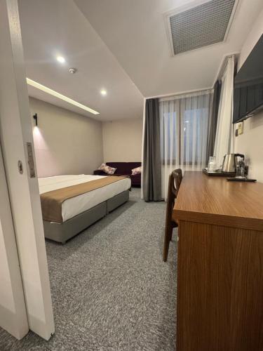 Ένα ή περισσότερα κρεβάτια σε δωμάτιο στο Ween Otel