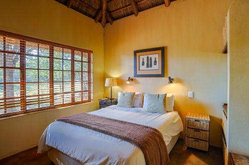 Ένα ή περισσότερα κρεβάτια σε δωμάτιο στο Bush Lodge Retreat Villa 29