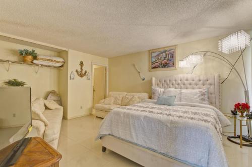 a bedroom with a large bed and a couch at Sea Vista in South Padre Island