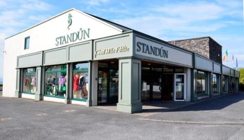 a store front of a shopping center with windows at Teachín an tSrutháin in Galway
