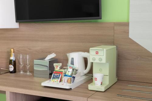 a microwave and a coffee maker on a counter at Palazzo Tasso in Sorrento