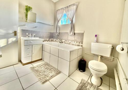 Ένα μπάνιο στο Sanctuary Guesthouse