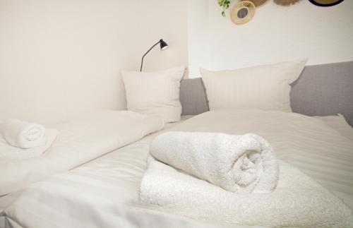 Ένα ή περισσότερα κρεβάτια σε δωμάτιο στο THEFIVE60 Apartments