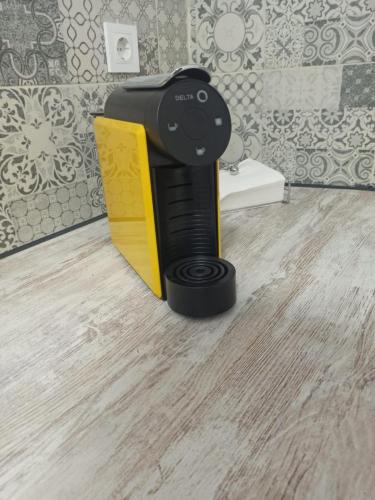 a black and yellow book holder in a bathroom at AL-Andalus in Elvas