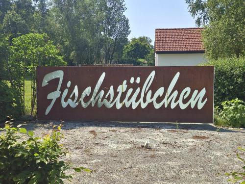 a large sign that readsitzkritkrithen is painted on it at Fischstübchen Neeberg Fewo 1 - Hase und Fuchs in Krummin