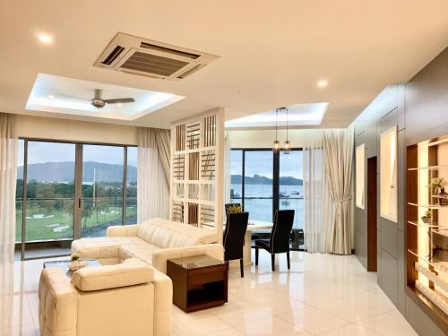 a living room with a couch and a table at Deco Home @ Imago The Loft in Kota Kinabalu