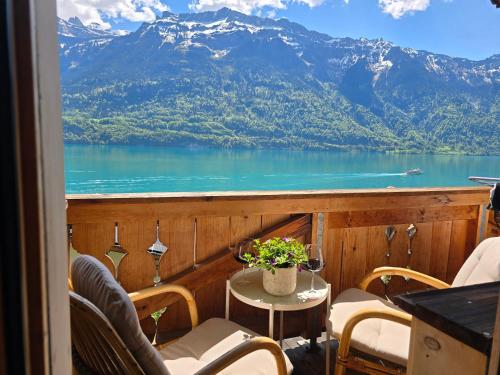 a balcony with a view of a lake and mountains at Chalet Swiss Alps in Niederried