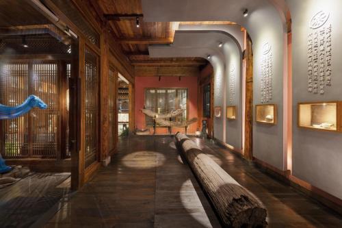 a hallway with a long bench in a museum at Hidden Moisture and Return to Simplicity Homestay in Mount Huangshan in Huangshan