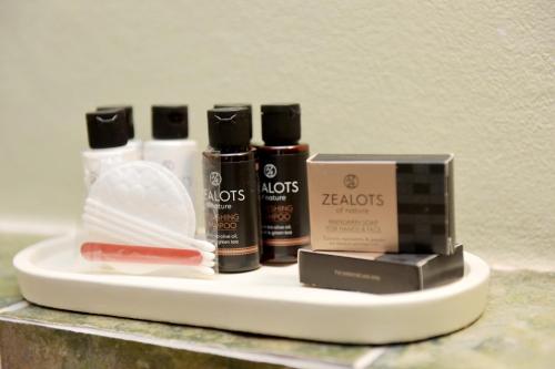 a shelf with someenty oils and cosmetics on it at Elaia-Fos in Rhodes Town