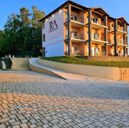 a building in front of a brick road at Just Joy Apartman in Vrdnik