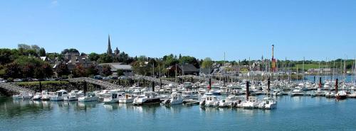 a bunch of boats are docked in a harbor at Chambres d'hôtes de charme au cœur de Tréguier in Tréguier