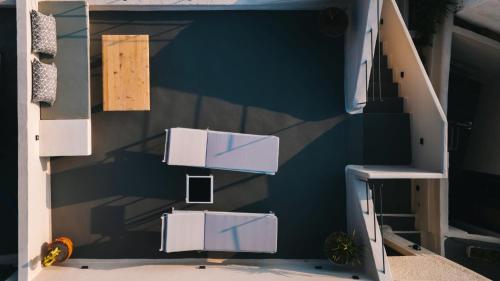 a room with a wall with two stairs and a stair case at Alaya Suites in Pirgos