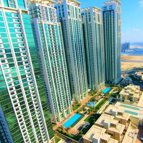 an aerial view of a city with tall buildings at Reem Island, Unique furnished one bedroom with amazing seaview in Abu Dhabi
