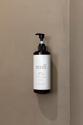 a bottle of soap sitting on a wall at Frederiksdal Sinatur Hotel & Konference in Kongens Lyngby