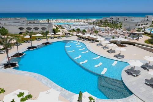 an aerial view of a resort with a large pool at Cleopatra Sidi Heneish in Marsa Matruh