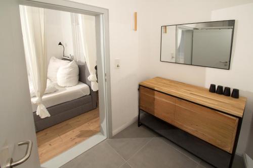 Ένα ή περισσότερα κρεβάτια σε δωμάτιο στο THEFIVE60 Apartments