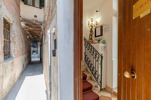 a hallway of a building with a staircase and a stair case at Cà Beatrice in Venice