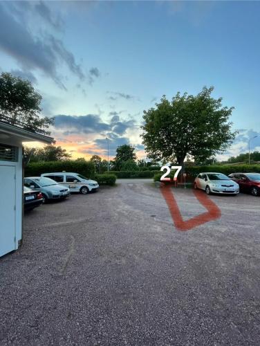 a bunch of cars parked in a parking lot at Liten lägenhet med gångavstånd till badstrand in Mariehamn