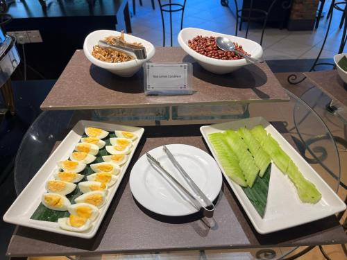 a buffet with eggs and celery and other food on a table at Hotel Shangri-la Kota Kinabalu in Kota Kinabalu