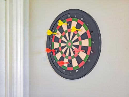a dartboard hanging on a wall at Tranquil Riverside Abode in Cornwall